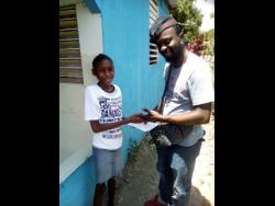 Danique Lawrence, whose story appeared in the Thursday’s STAR, receives her donation from entertainer Rising Sonn.