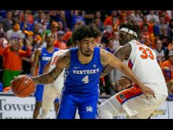 Kentucky forward Nick Richards drives during the second half of an NCAA college basketball game against Florida on Saturday, March 7, 2020, in Gainesville, Florida. 