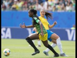 Konya Plummer (left) dribbles past Brazil’s Beatriz Zaneratto Joao during their first-round encounter at the 2019 FIFA Women’s World Cup.