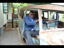 In this 2017 photo, tourism minister Edmund Bartlett ‘takes a spin’ in the Volkswagen bus that belonged to late reggae icon, Bob Marley, which is on the grounds of the Trench Town Culture Yard Museum in St Andrew.