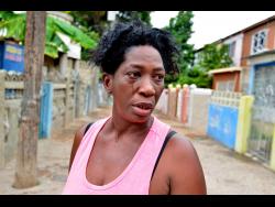 Marjorie Hinds cries as she remembers the events in Tivoli Gardens which left her spouse dead and her right arm crippled.