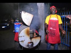 Rueben Hickinson, a pan chicken vendor along Red Hills Road in Kingston.