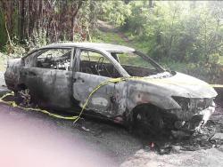 The car where the burnt body of Tonia McDonald was found with the throat slashed at Sherwood Forest, Portland, Monday night.