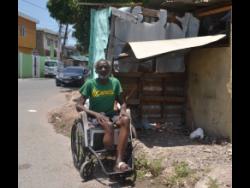 Allen shows the news team the shed he calls home.