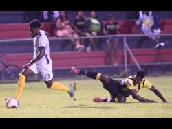 File
Waterhouse’s Kenroy Howell (left) slips away from a tackle from Jerome Odilon (right) from Don Bosco during a Concacaf club football match at the Anthony Spaulding Sports Complexon in  February 2, 2020.