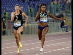 Jamaica’s Elaine Thompson-Herah (right) wins in 10.85 seconds the women’s 100m competition at the Golden Gala Pietro Mennea IAAF Diamond League athletics meet in Rome, yesterday. 