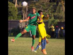 File
Humble Lion’s Andre Clennon (left) jumps high for a ball with Vere United’s Kenroy Lumsden during their Red Stripe Premier League game at the Wembley Centre of Excellence in Hayes, Clarendon on Sunday, December 15, 2019.