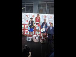 File
Jamaica’s Joshua Frazer (second left) stands atop the  podium after beating Marat Gashimov (left) in the final of the Leszek Drogosz Memorial International Boxing Tournament in Kielce, Poland, on October 25, 2019.