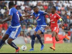 File
Mount Pleasant’s Ronaldo Rodney (17) sheilds the ball from Rochane Smith (9) of UWI FC during the first leg of their quarter-final matchup at the Anthony Spaullding Sports Complex on March 24, 2019.