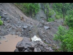This section of the Gordon Town main road is impassable following landslides.