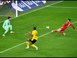 Bayern’s Robert Lewandowski scores a goal that was disallowed for offside during the German Bundesliga match between Borussia Dortmund and Bayern Munich in Dortmund, Germany, Saturday, November 7, 2020.