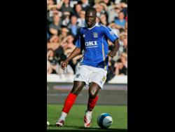 In this file photo dated Saturday, April 12, 2008, Portsmouth’s Papa Bouba Diop is seen in action against Newcastle during their English Premier League match at Fratton Park Stadium in Portsmouth, England. 