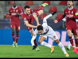 Liverpool’s Diogo Jota is blocked by FC Midtjylland’s Mikael Andersson during their Champions League Group D match at MCH Arena in Herning, Denmark, on December 9, 2020. 