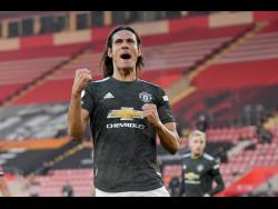 Manchester United’s Edinson Cavani celebrates after scoring his side’s second goal during an English Premier League match between Southampton and Manchester United at the St Mary’s stadium in Southampton, England, Sunday, November 29, 2020. 