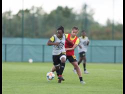 File
Tiffany Cameron dribbles away from teammate Toriana Patterson during Reggae Girlz training session in Reims, France on June 10, 2019.