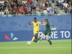 Jamaica’s Jody Brown (left) dribbles away from Australia’s Karly Roestbakken in a first round match at the FIFA Women’s World Cup in 2019.