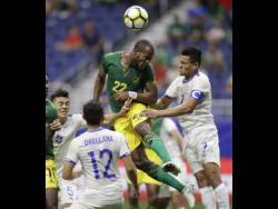 File
Jamaica’s Romario Williams (second right) tries to make a shot on goal against El Salvador’s Darwin Ceren (right) during a Concacaf Gold Cup match in San Antonio in  July 2017.