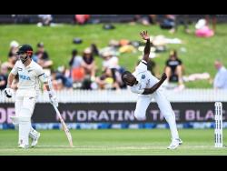 West Indies Kemar Roach bowls during play on day two of the first cricket test between the West Indies and New Zealand in Hamilton, New Zealand, Friday, December 4, 2020. 