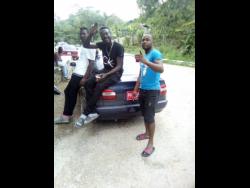 Taxi operators (from left) Alrick Smith, Renault Riley and Omar Bryan decided to park and protest against the bad road.