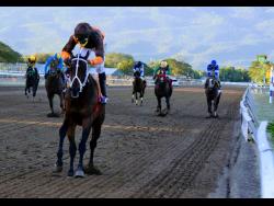 Eroy, ridden by Omar Walker, wins the Ash Wednesday Trophy, the 11th race at Caymanas Park, over six and a half furlongs yesterday.