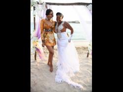 Fellow dancehall artiste and close friend of the bride, D’Angel, was at Saturday’s ‘Royal’ wedding. Here she shares the spotlight with the newly-minted Mrs ‘Queenie’ Scarlett. 