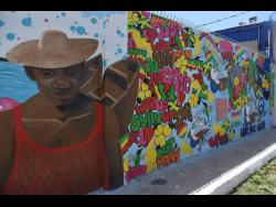 One of the murals adding some colour to communities in Central Kingston. This one is on Water Lane.