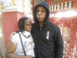 Satchell Brown (left) and her common-law husband Gregory Lambert mourn the loss of their son Omar.