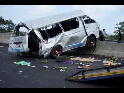 Five people are confirmed dead after this minibus crashed into a small truck on Highway 2000 yesterday.