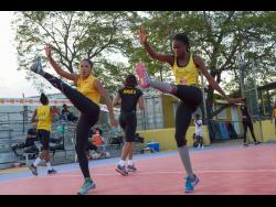 Sunshine Girls Adean Thomas (left) and Nichole Dixon go through their paces during a training session at the Leila Robinson Courts at the National Stadium on Wednesday, June 5, 2019.
