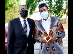 Beenie Man (right) outside the courthouse with his lawyer Roderick Gordon.
