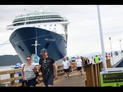 Tourists arrive on the Marella Discovery cruise ship at the Port Royal Cruise Ship Pier on January 20, 2020.
