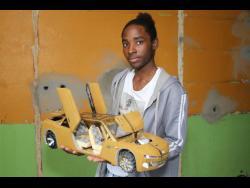 Oshane Dunstan with one of his creations.