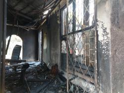 The burnt-out house of Yvonne Findley, whose charred remains were found inside.