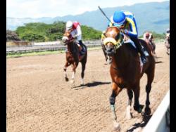 File
TRICKY ONE (on the rails), ridden by Oshane Nugent, wins the PICK3 Simple Ting Fi Win Trophy (third race) at Caymanas Park on Sunday, November 29, 2020.  