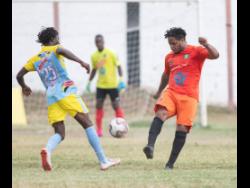 File
Rafiek Thomas (left) of Waterhouse FC goes up against Tivoli Garden’s Ranike Anderson in a  Red Stripe Premier League match played at the Edward Seaga Sports Complex in Kingston last February.