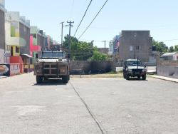 Military vehicles parked at Site, a section of the violence-prone Dunkirk community. 