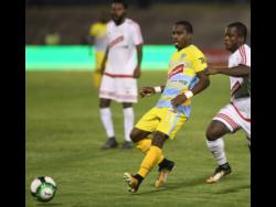 Tremaine Stewart (second right)  seen here playing for Waterhouse Football Club on April 23, 2018. 