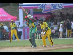 Gayle Cricket Club’s Jermaine Chisholm (left) plays a shot in his innings against Orange Hill in the final of the Social Development Commission Twenty20 Community Cricket Competition on Sunday, August 27, 2019.