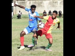 Courtney Hill (right) of Humble Lion tries to win the ball from Portmore United’s Chavany Willis during their Jamaica Premier League match at the Spanish Town Prison Oval on Sunday, January 5, 2020.