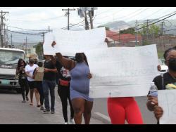 Clarendon promoters on Sunday walked from Bargain Village to the May Pen Police Station to demonstrate what they refer to as  double standard treatment from the government and the police as it relates to breaches of COVID restrictions.