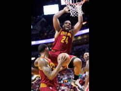 National basketballer Samardo Samuels (top) during his time with the Cleveland Cavaliers in the NBA in 2011.