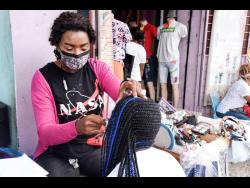 Ashley, a beautician who operates on Barry Street, downtown Kingston, says the reopening of the entertainment sector will benefit her trade.