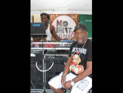 Neville ‘Val-T’ Thompson (right), sound manager of No Limit International, and disc jockey Ricardo Roberts.          