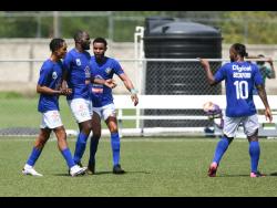 Mount Pleasant’s Francois Swaby (second left)  and teammates celebrate his goal against Humble Lion in the  Jamaica Premier League fixture held at the UWI/JFF Captain Horace Burrell Centre of Excellence last Saturday.