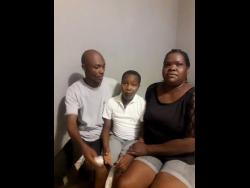 Gladstone Palmer (left) and spouse Sharon Allen with their son Ramel.