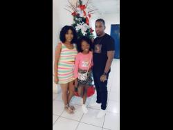 Shantoy (centre) with her parents Kimanie and Dave Ellis.