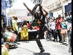 Dancer Oliver Morris of the Binghistra Orchestra performs in Water Lane, Kingston at a past staging of Kingston Creative Artwalk.