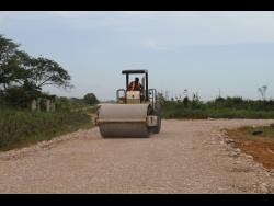 The farm road in St Jago, Toll Gate, Clarendon, being repaired.