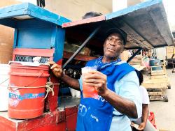 A sky juice vendor in downtown Kingston.