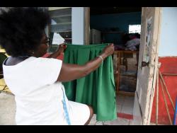 Maureen Pinto from Bedward Gardens near August Town in St Andrew, makes school uniforms but has seen tough times since schools were closed to face-to-face learning due to COVID-19.